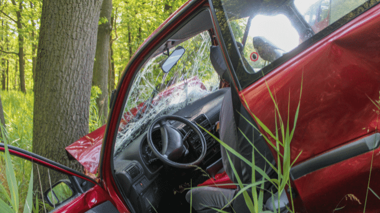 Red car damaged in Kentucky after a car wreck