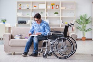 Young student on wheelchair in disability concept