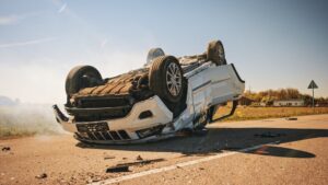 A car flipped on its side after a rollover accident