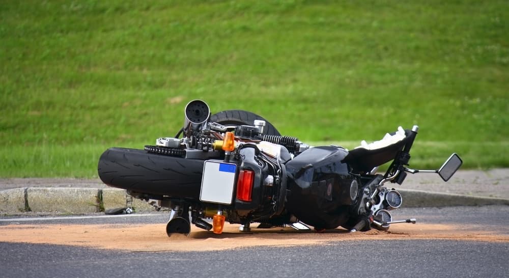 Motorcycle crash scene on the street.