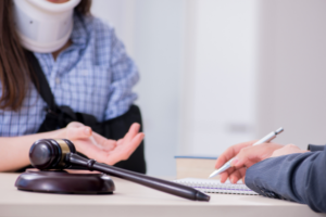 An injured employee meets with a lawyer for insurance advice, representing different types of losses in a personal injury case. 