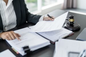A lawyer at his desk with a gavel and lawbook, symbolizing legal support in recovering special damages for injury-related expenses. 