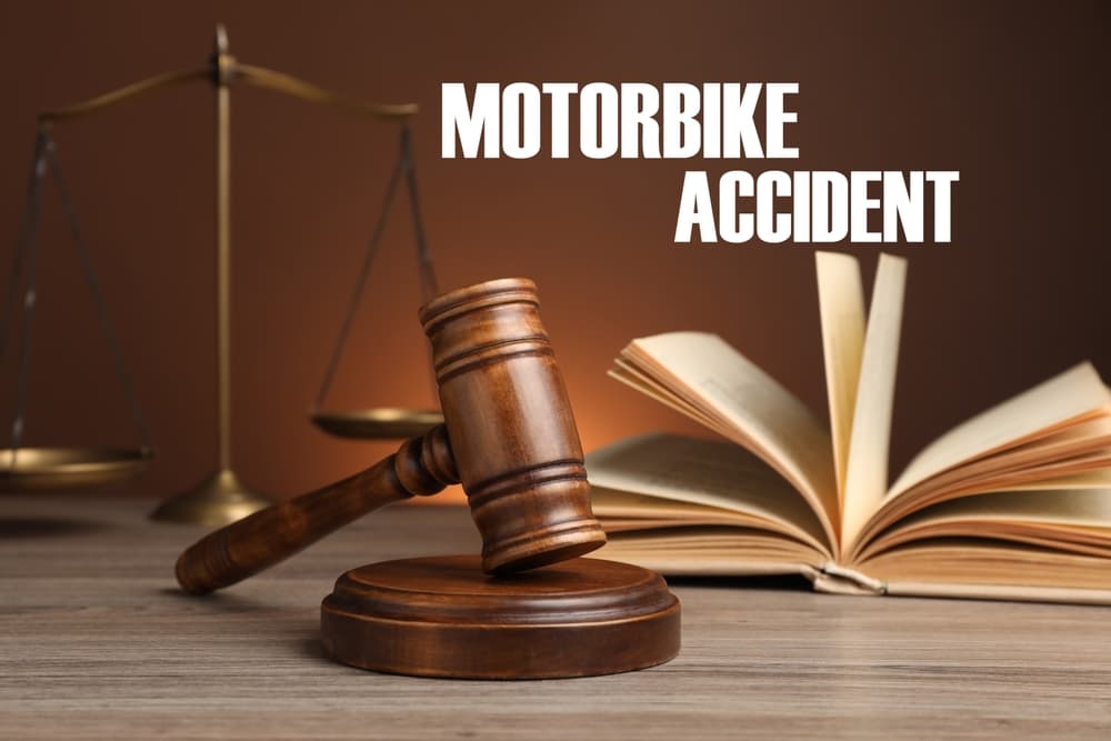 Kentucky motorcycle accident law and legal guidance for injured motorcyclists. Gavel, law book, and scales representing Kentucky motorcycle accident law and legal rights for injured riders.